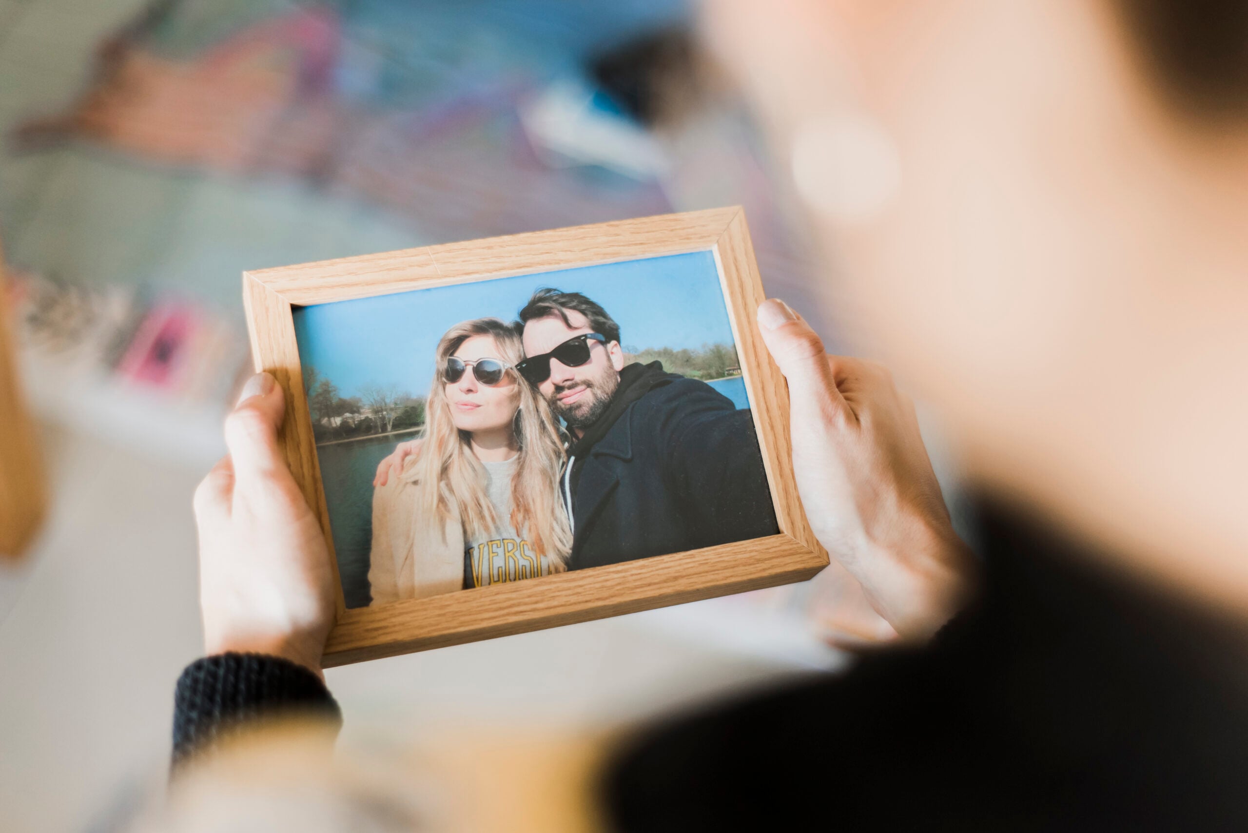 human-hand-holding-photo-frame